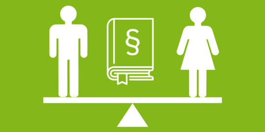 Auf eine Wippe steht ein Mann und eine Frau, zwischen ihnen ein Gesetzbuch